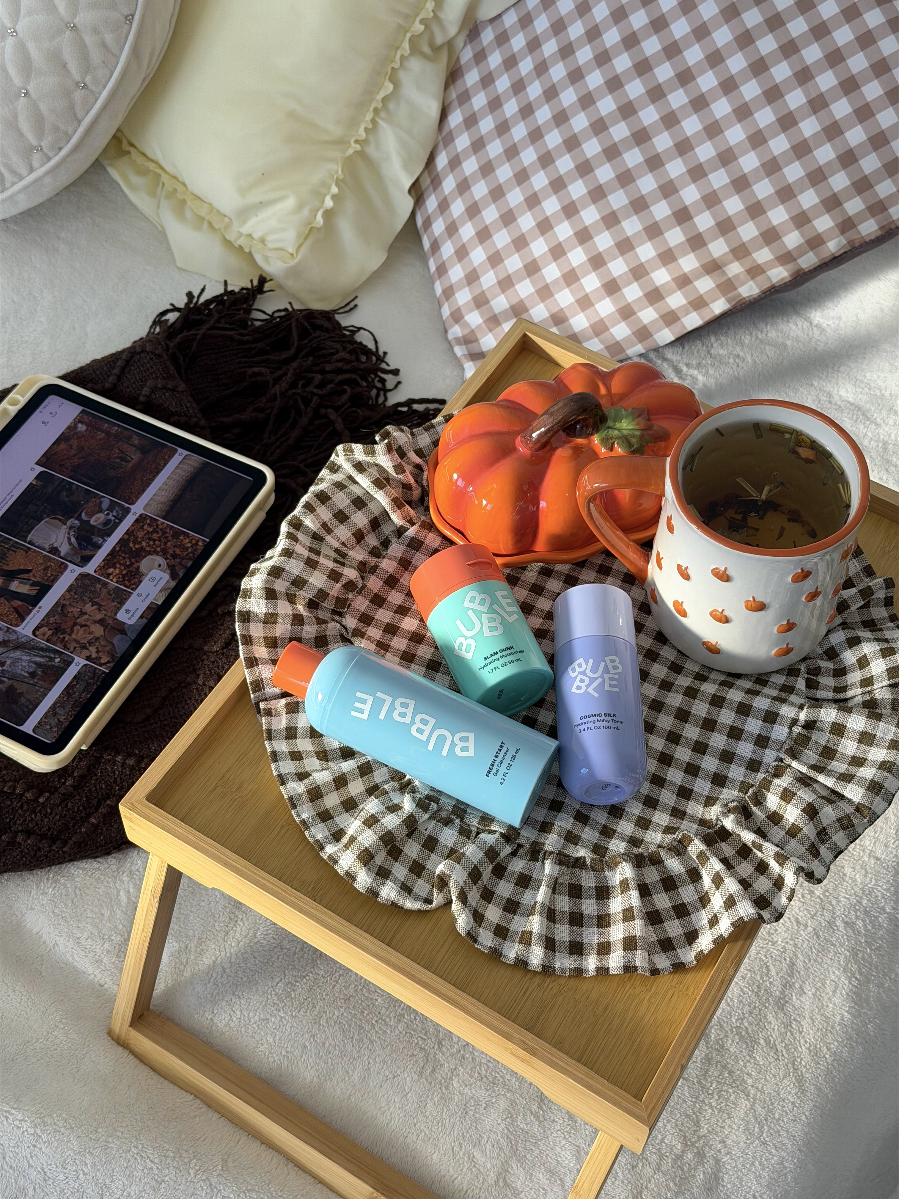 Bubble skincare autumn flat lay with pumpkin decor and tea